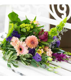 Wrapped Handtied Bouquet. An arrangement by Napanee Blooms.