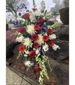 Easel of Red, White, and Blue. An arrangement by Renton Flower Shop.