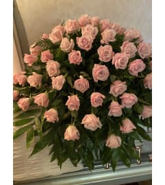 Pink Casket Spray #1. An arrangement by Seasons Change Designs.