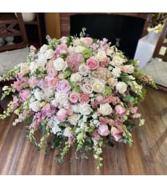 Pastel Casket Spray #2. An arrangement by Seasons Change Designs.