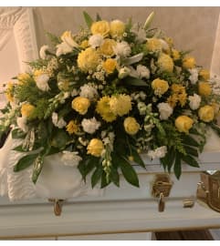 Yellow and white casket spray #4. An arrangement by Seasons Change Designs.