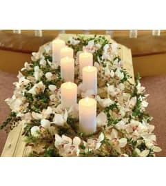 Orchid Light Casket Spray #8. An arrangement by Seasons Change Designs.