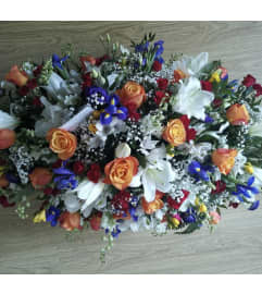 Casket spray #10. An arrangement by Seasons Change Designs.