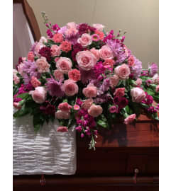 Casket spray #22. An arrangement by Seasons Change Designs.