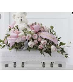 Child's Casket Spray. An arrangement by Seasons Change Designs.