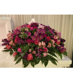 Hot Pink Casket Spray. An arrangement by Seasons Change Designs.