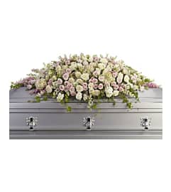 The Always Adored Casket Spray By Teleflora. An arrangement by Michael's Flowers.