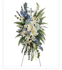 An Ocean Breeze Spray with crystal cross. An arrangement by Seasons Change Designs.