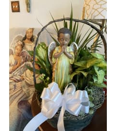 Dish with African American Angel. An arrangement by Seasons Change Designs.