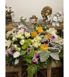 The Angel Holding A Child. An arrangement by Seasons Change Designs.
