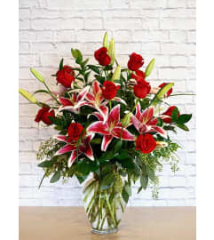12 Roses with fragrant Stargazer Lilies. An arrangement by Salinas Floral and Gifts.