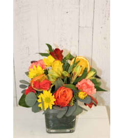 Vibrant Citrus. An arrangement by Red Rose Incredible Florist.