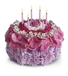 Have your Cake.... An arrangement by The Village Green Florist.