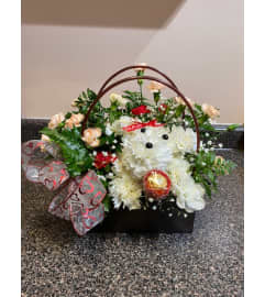puppy flower arrangement. An arrangement by Sunrise Floral and Gifts.