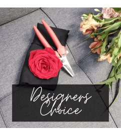 Designer's Choice Wrapped Arrangement. An arrangement by Now and Forever Flower Boutique.