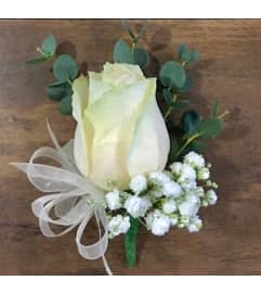 Fancy White Rose Boutonniere 2024. An arrangement by Northwest Florist.