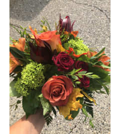 Designers Choice Rich Tones Arrangement. An arrangement by Renton Flower Shop.