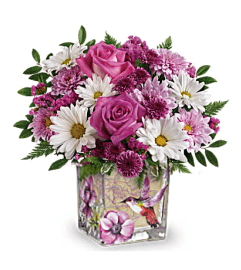 Lovely Hummingbird. An arrangement by Awesome Blossom.