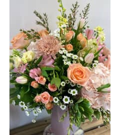 Designer's Choice Soft Pink Mix Arrangement. An arrangement by Linda's Floral Designs.