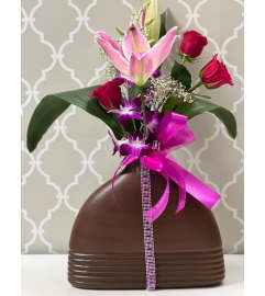 Just for Her in Elegant Brown Vase. An arrangement by Shalimar Flower Shop.