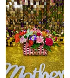 Mamis Mini Bolsa. An arrangement by Manny's Flower Design.