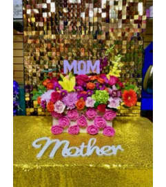 Moms box. An arrangement by Manny's Flower Design.