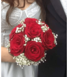 RED ROSES and BABIES BREATH NOSEGAY * PROM. An arrangement by Flowers by Priscilla.