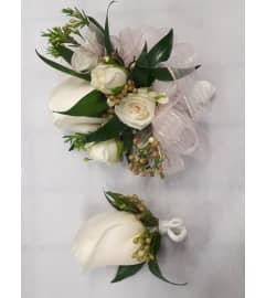Corsage and Boutonniere as set. An arrangement by Jennifer's Flowers and Gifts.