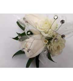 Ivory Rose Corsage with Crystal. An arrangement by Jennifer's Flowers and Gifts.