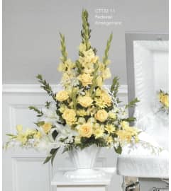 Yellow and White Pedestal Arrangement(Ctt32-11). An arrangement by Roma Flowers and Gifts.
