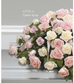 Pink and White Rose Casket Spray(Ctt70-11). An arrangement by Roma Flowers and Gifts.