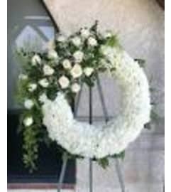 SYMPATHY WREATH PURE WHITE ELEGENCE. An arrangement by Salinas Floral and Gifts.