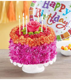 Vibrant Wishes Flower Cake. An arrangement by L and J Blooms.