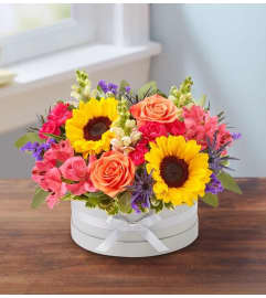 Bountiful Hatbox. An arrangement by L and J Blooms.
