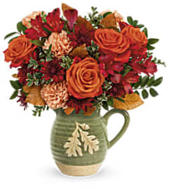 Charming Acorn Teleflora. An arrangement by Belak Flowers.