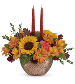 The Autumn Copper Centerpiece (Teleflora). An arrangement by North Liberty Flower Shop.