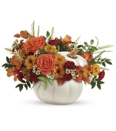 Enchanted Harvest Pumpkin (Teleflora). An arrangement by North Liberty Flower Shop.