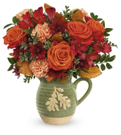Charming Acorn Bouquet (Teleflora). An arrangement by North Liberty Flower Shop.