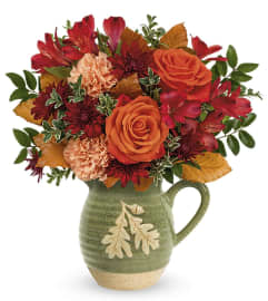 Charming Acorn Bouquet (Teleflora). An arrangement by North Liberty Flower Shop.