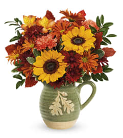 Autumn Acorn Pitcher (Teleflora). An arrangement by North Liberty Flower Shop.