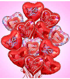 One Dozen I love you mylar. An arrangement by Oliver Flower Shop.