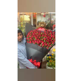 Presentation Style Heart Wrapped Rose. An arrangement by Rose Flowers.
