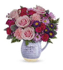 A Playful Pitcher Bouquet. An arrangement by Flowers of Jacksonville.