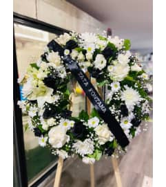 Wreath Black and White. An arrangement by Geni's Florist and Gifts.