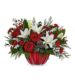 ELEGANT VIBRANT CHRISTMAS CENTERPIECE. An arrangement by Elegant Florist.