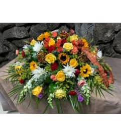 Autumn Casket Cover. An arrangement by Flowers By Maria.