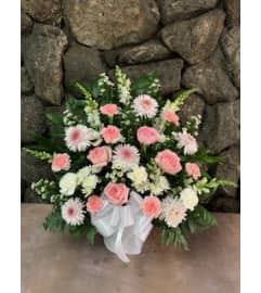 Basket Tribute -- Pink and White. An arrangement by Flowers By Maria.