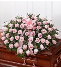 Pink rose casketsprayy. An arrangement by Win's Flowers.