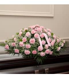 Pink carnations casketspray. An arrangement by Win's Flowers.