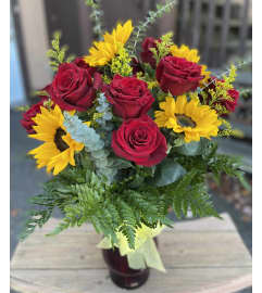 Red roses and Sunflowers Arrangement. An arrangement by Violeta's Flower Shop.